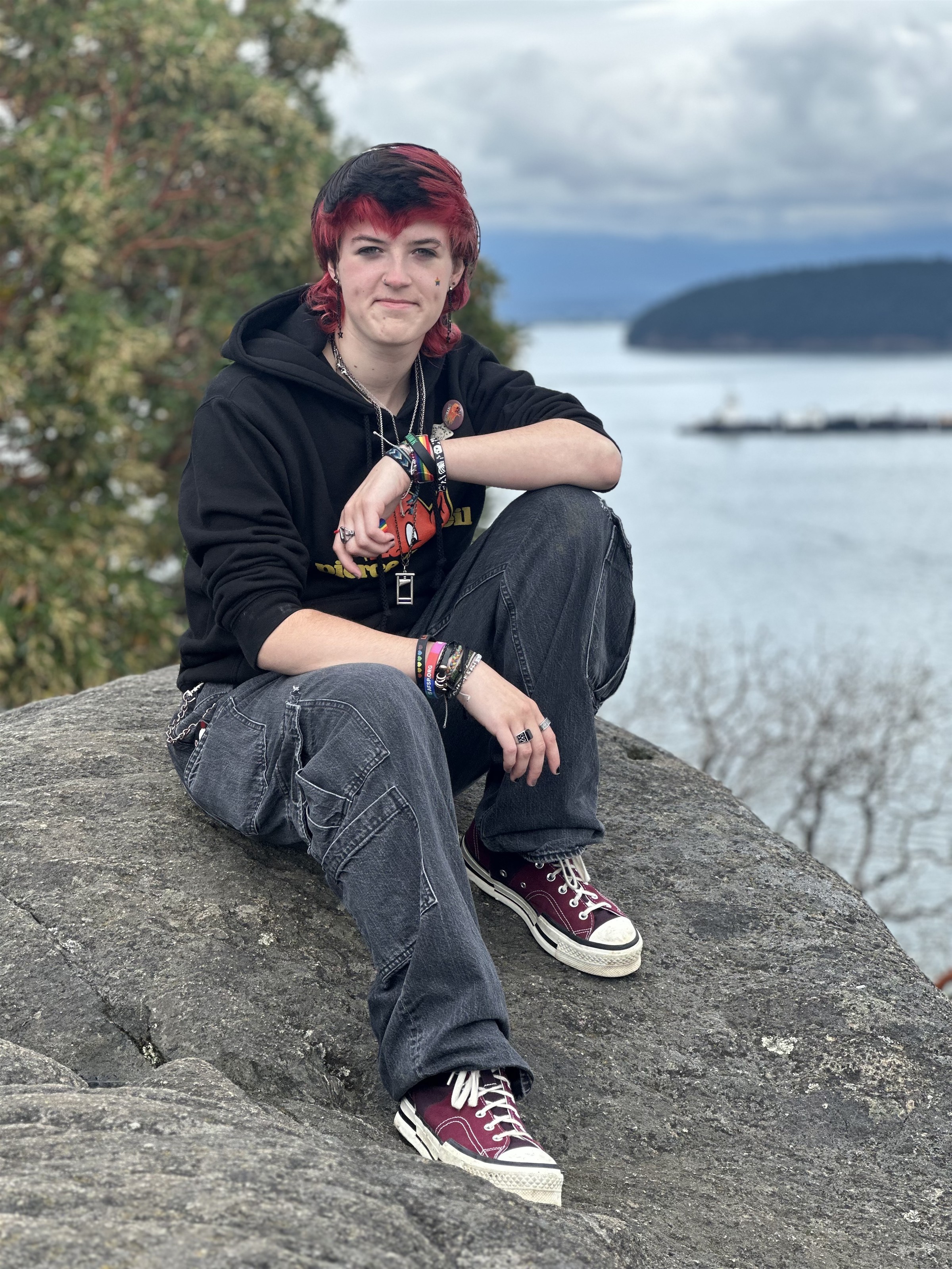 Student sitting on a rock 